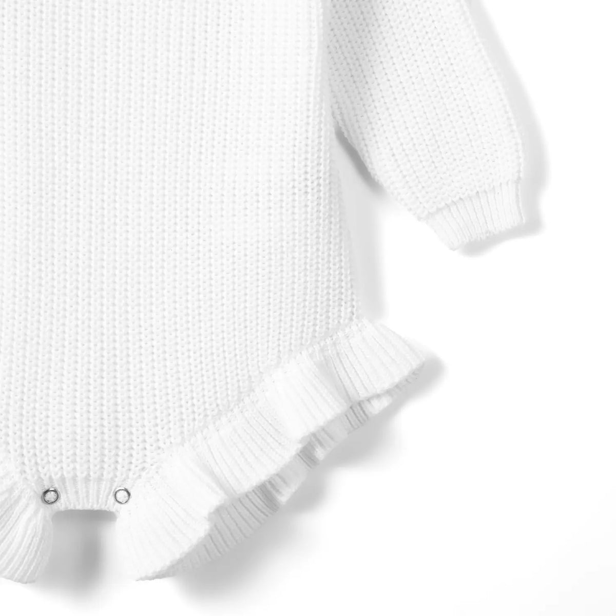 Side view of thick cotton weave, elasticized ribbed cuff, and gathered ruffle trim on leg