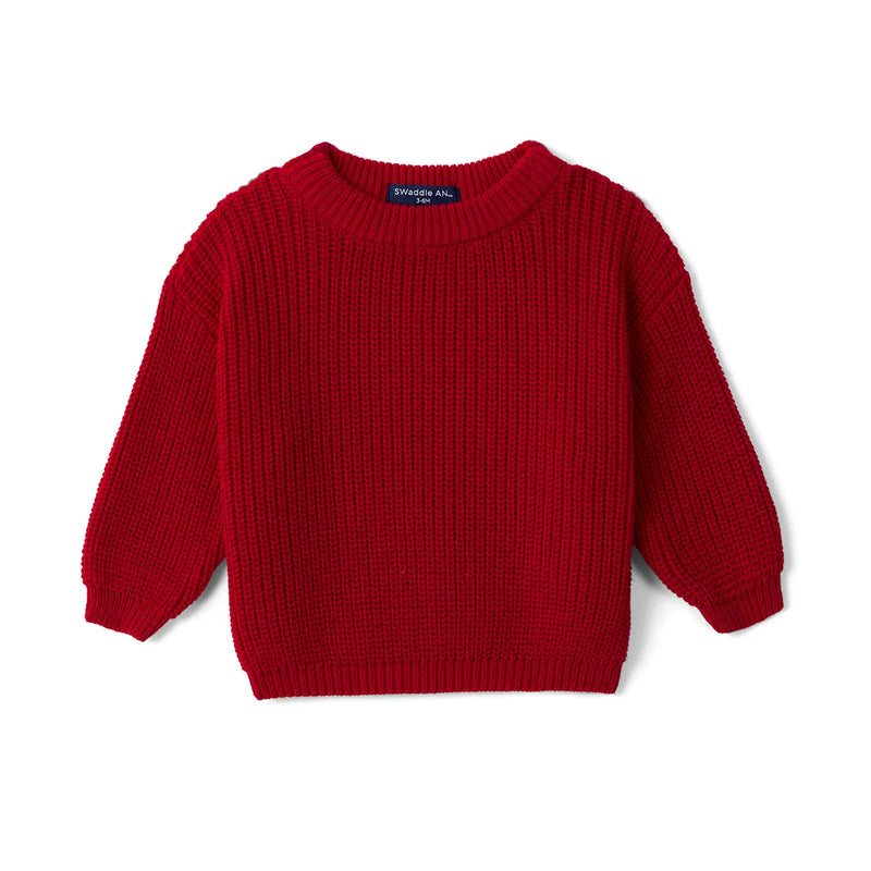 Red chunky knit baby sweater with ribbed cuffs and hem on white background