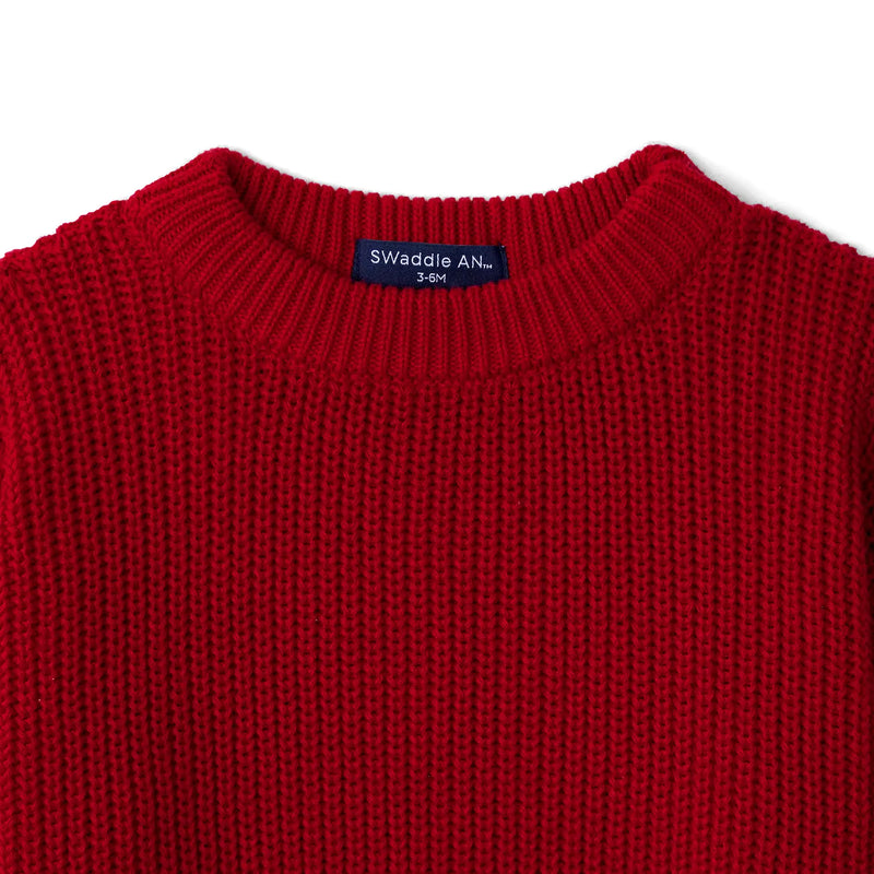 Navy SWaddle AN brand label inside red cotton crewneck showing size 3-6M