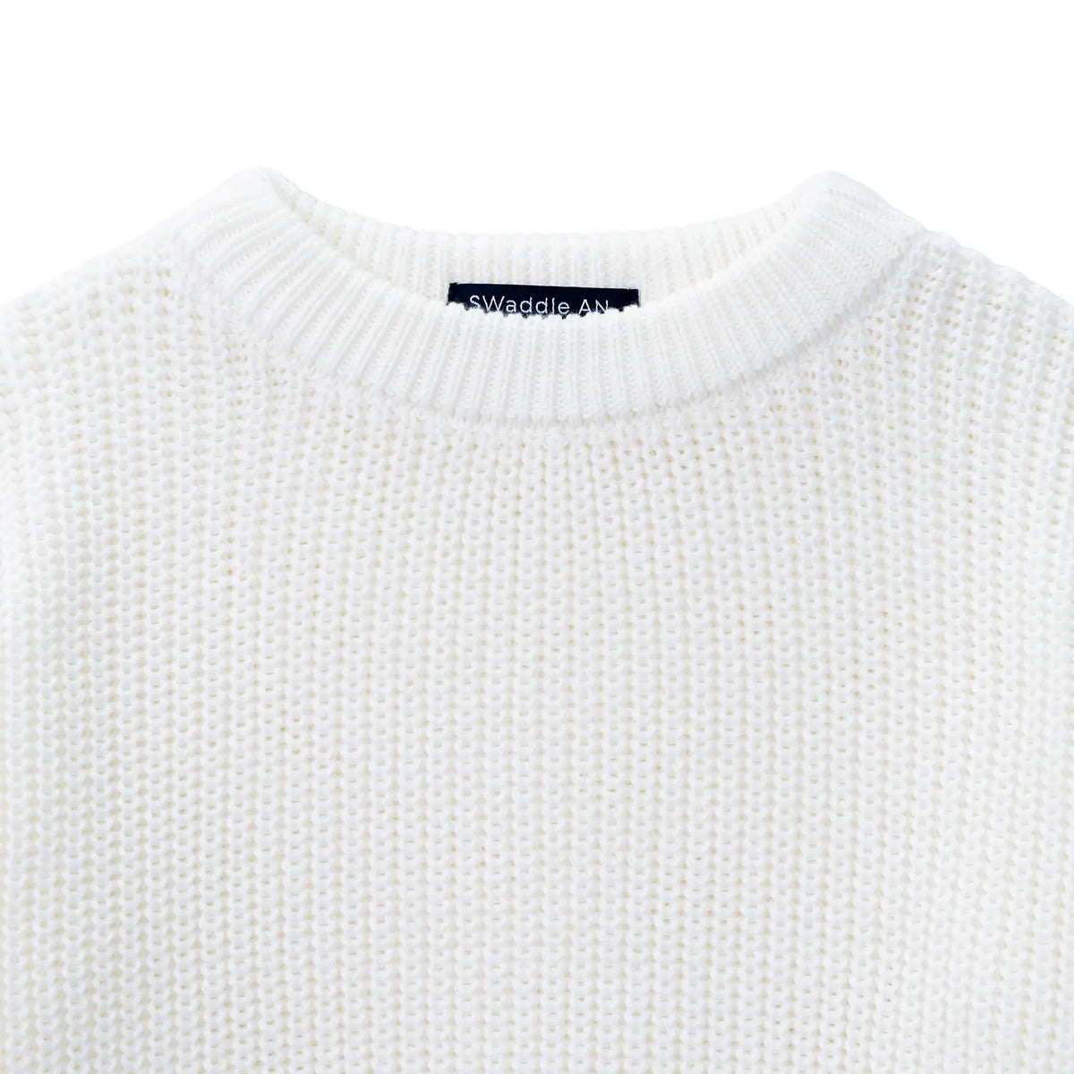 Close-up of ribbed crewneck collar showing navy SWaddle AN brand tag inside