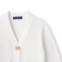 Upper white cardigan section with V-neck collar, ribbed texture, wood button, and navy brand label