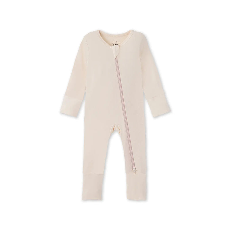 Sand-colored bamboo convertible footie pajamas flat lay with long sleeves and central diagonal zipper on white background