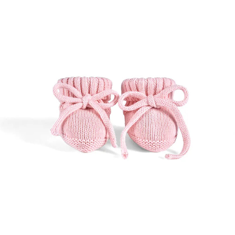 Front view of pink knit booties showing symmetrical bow details and elasticized ribbed ankle cuffs