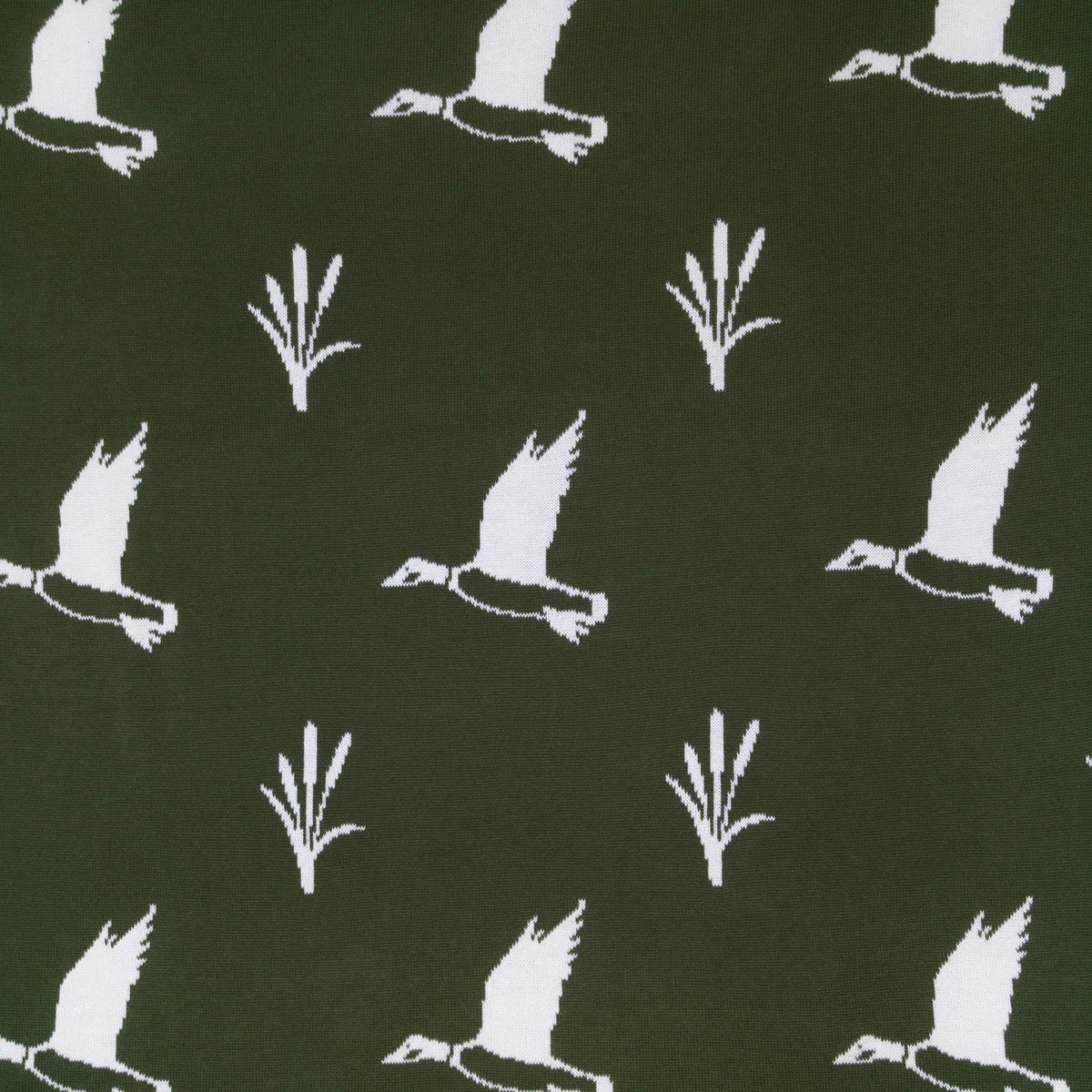 Close-up of dark olive green jacquard knit baby blanket with white flying mallard ducks
