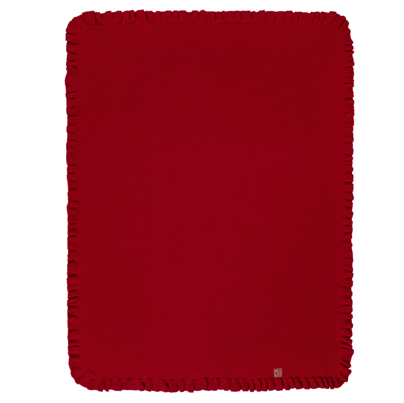 Flat-lay of spread red ruffled edge knit baby blanket showing full waffle texture and corner logo tag