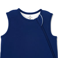 Ribbed collar and white-edged zipper track on navy baby sleep sack