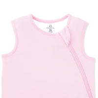 Ribbed collar trim and fabric zipper guard detail on dusty rose baby sleep sack neckline