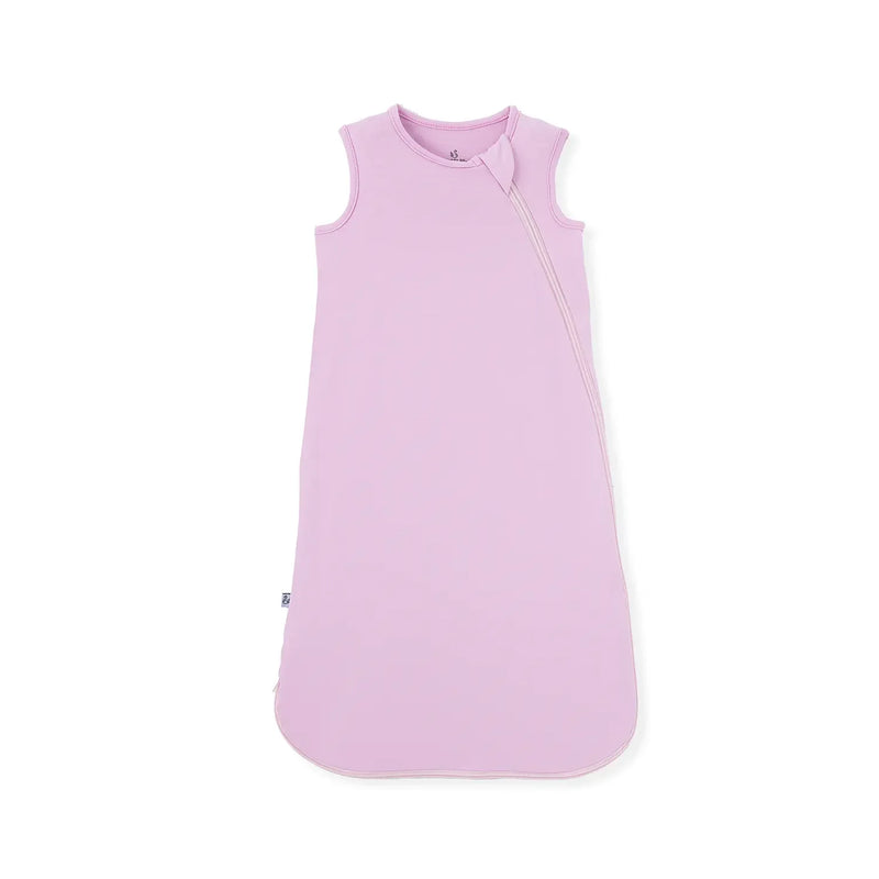 Pastel pink bamboo sleep sack flat lay with diagonal zipper on white background