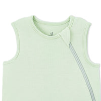Ribbed collar detail with fabric-covered zipper pull on sage green sleep sack