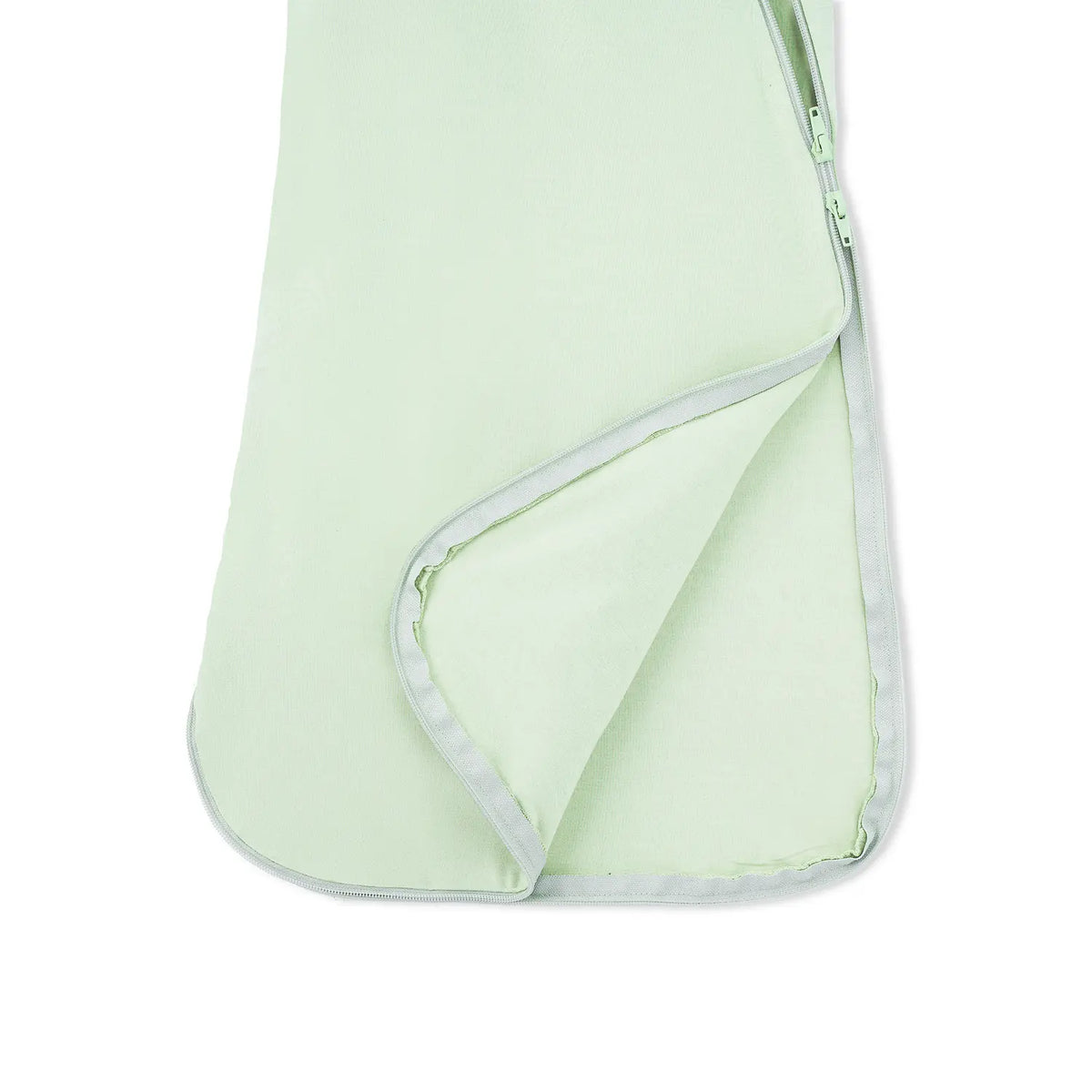Bottom corner of sleep sack showing interior lining and light grey piping trim