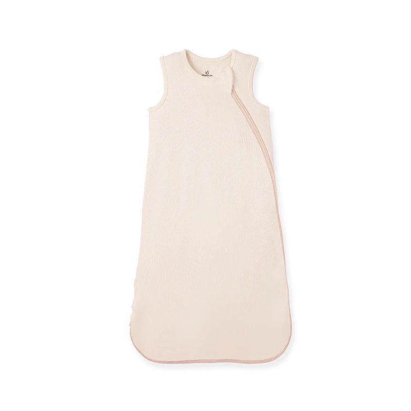 Sand-colored sleeveless bamboo sleep sack with diagonal zipper on white background
