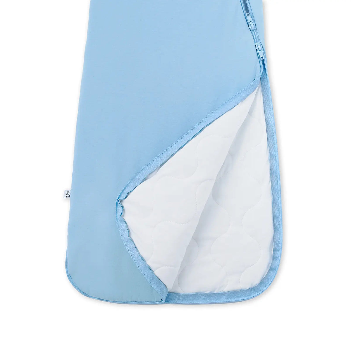 Open zipper revealing white quilted inner insulation layer of blue sleep sack