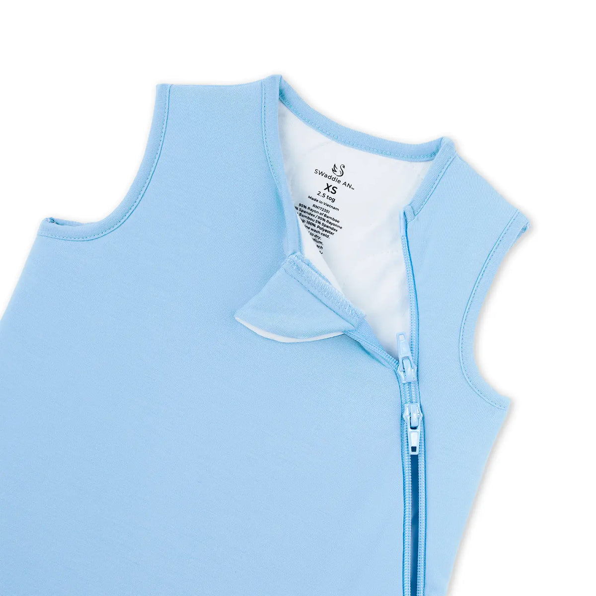 Close up of unzipped blue sleep sack showing white lining and neck label