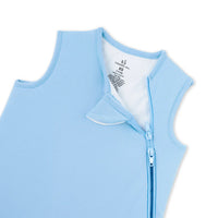 Close up of unzipped blue sleep sack showing white lining and neck label
