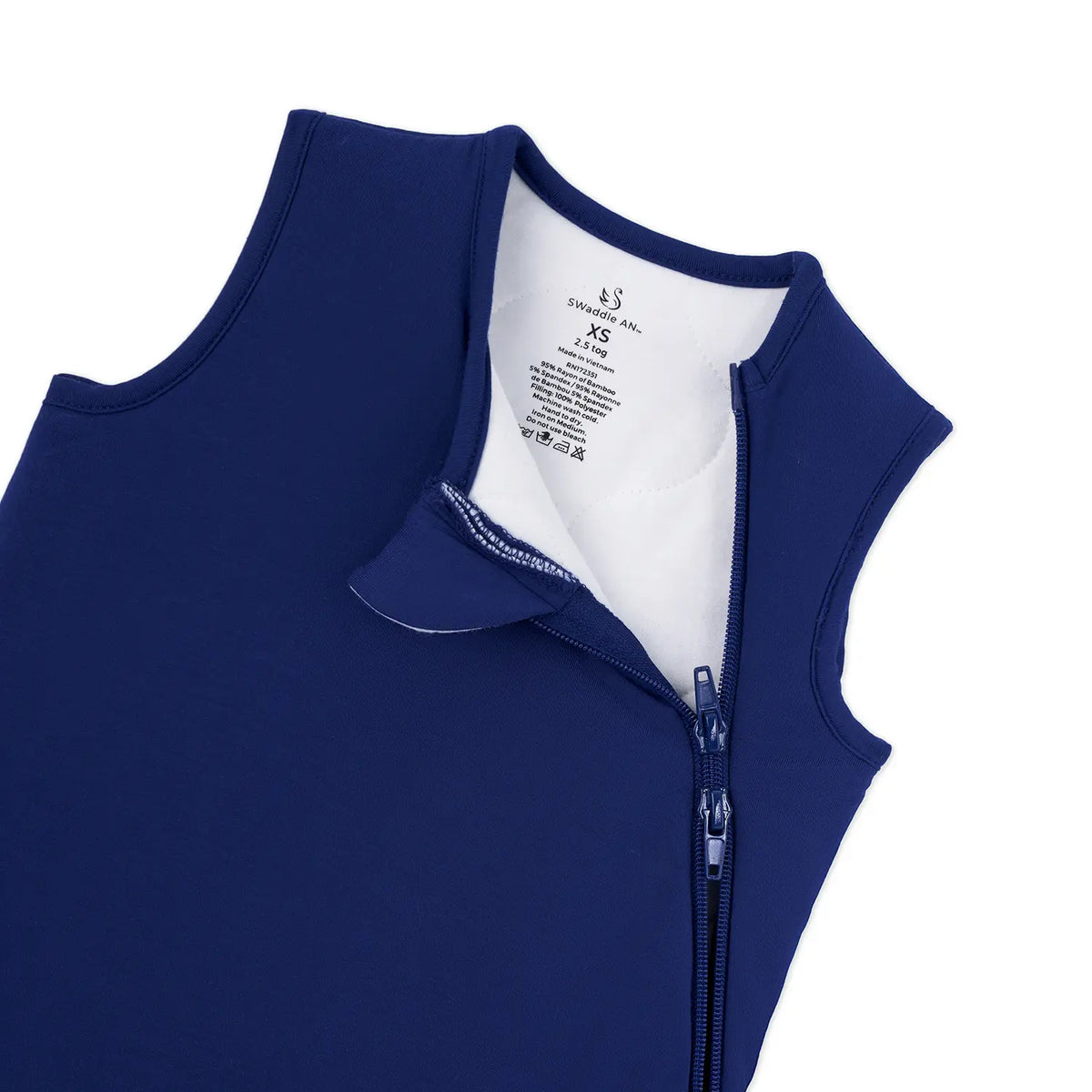 White tag showing SwaddleAn logo and 2.5 tog size XS on navy fabric
