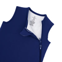 White tag showing SwaddleAn logo and 2.5 tog size XS on navy fabric