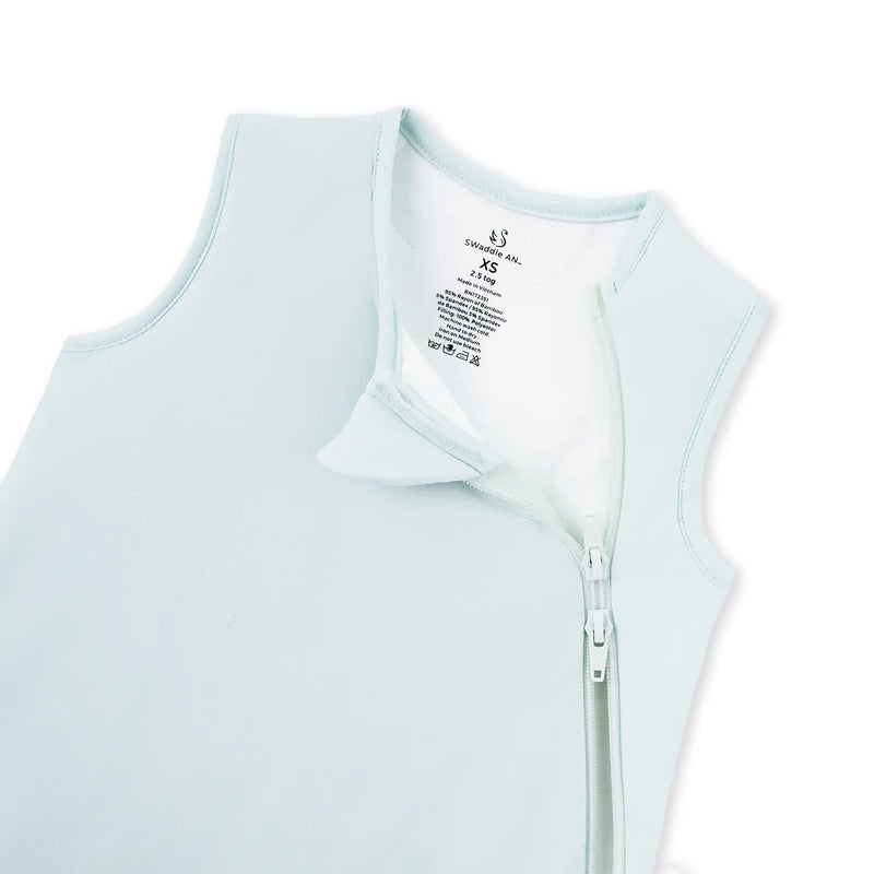 Close up of mint baby sleep sack neck label showing size XS and 2.5 tog rating