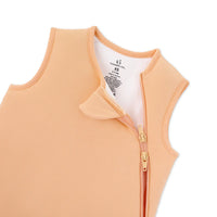 Close up of peach sleep sack neckline and gold zipper