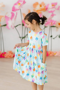 Girls light blue twirl pocket dress with colorful popsicle print short sleeve