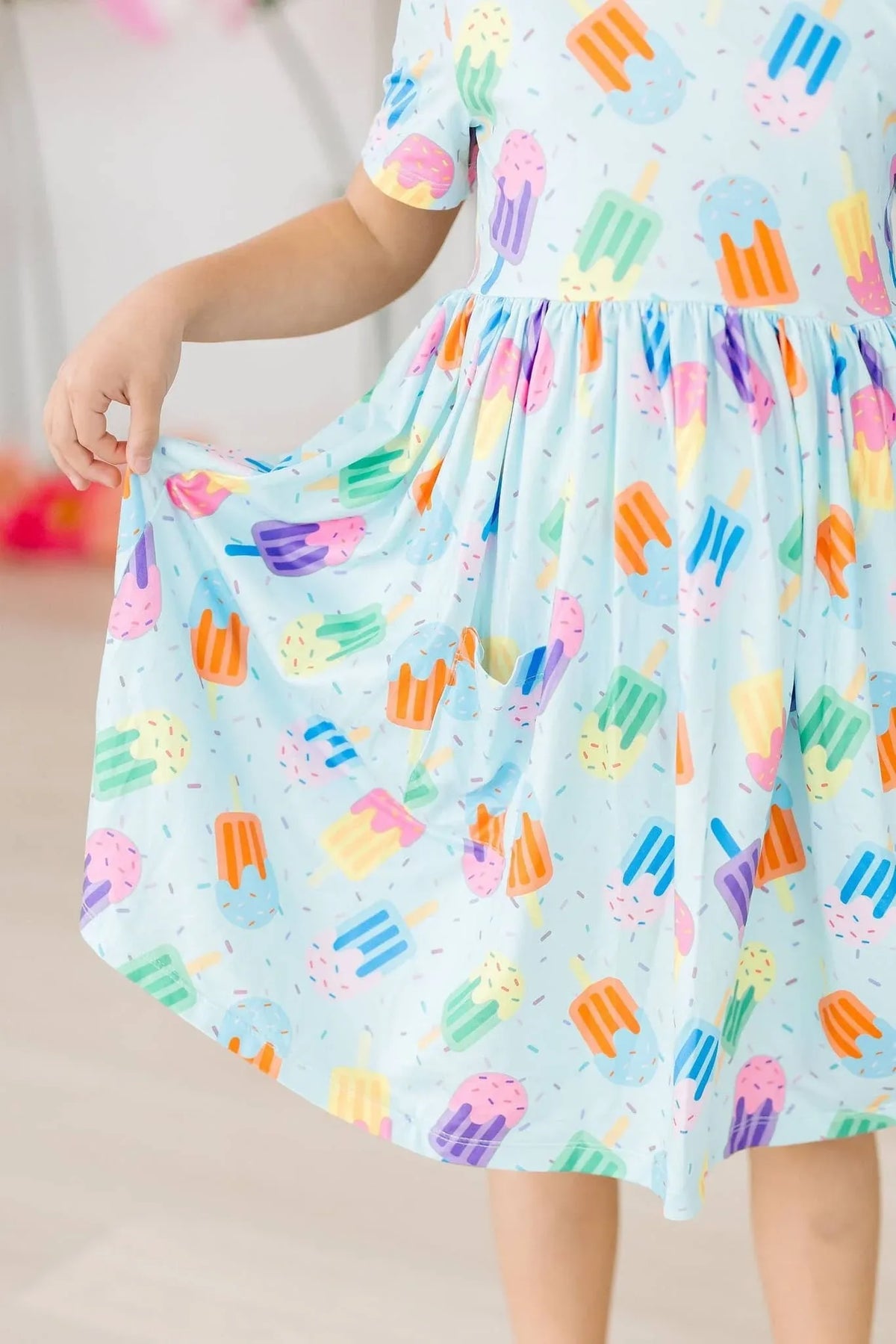 Girls light blue twirl pocket dress with colorful popsicle print short sleeve
