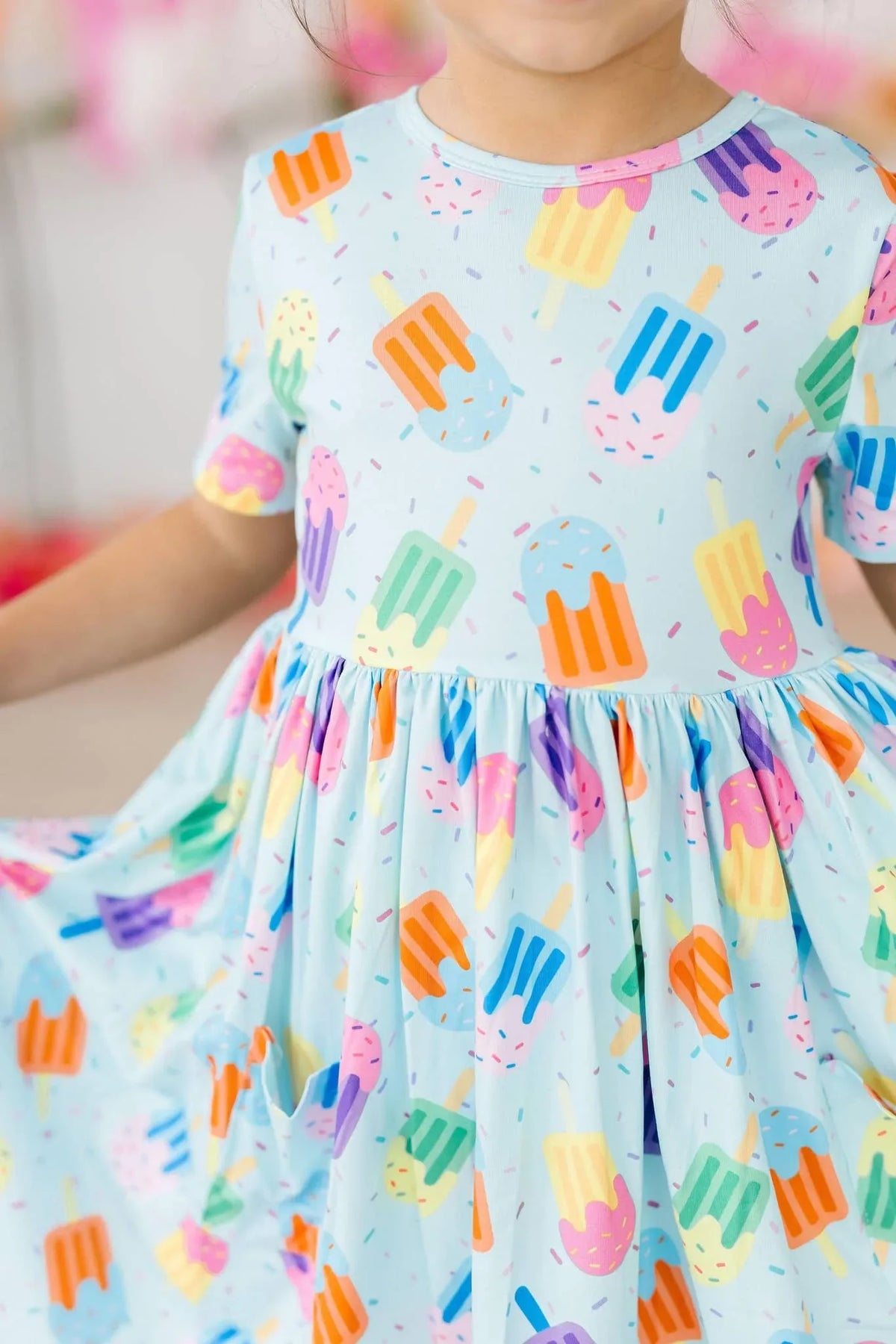 Girls light blue twirl dress with colorful popsicle print and pockets, short sleeve for kids