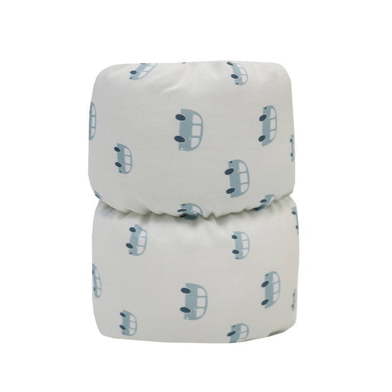 Tag Cornflower Comfy Cradle nursing pillow featuring a playful car pattern, perfect for supporting feeding moments with comfort and style.