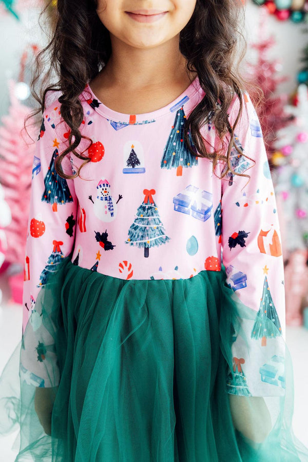 Pink long sleeve tutu dress for girls with Christmas trees, snowmen, and gifts print, featuring a green tulle skirt.