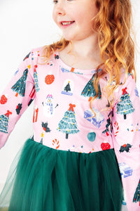 Pink long sleeve dress with Christmas print and green tutu skirt for little dancers. festive holiday attire for play and special occasions.