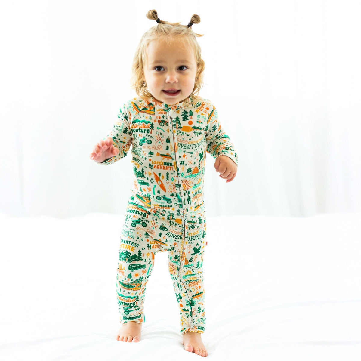 The Second-Skin Toddler Convertible Romper displayed in a playful setting, highlighting its versatile design for nap time or playtime.