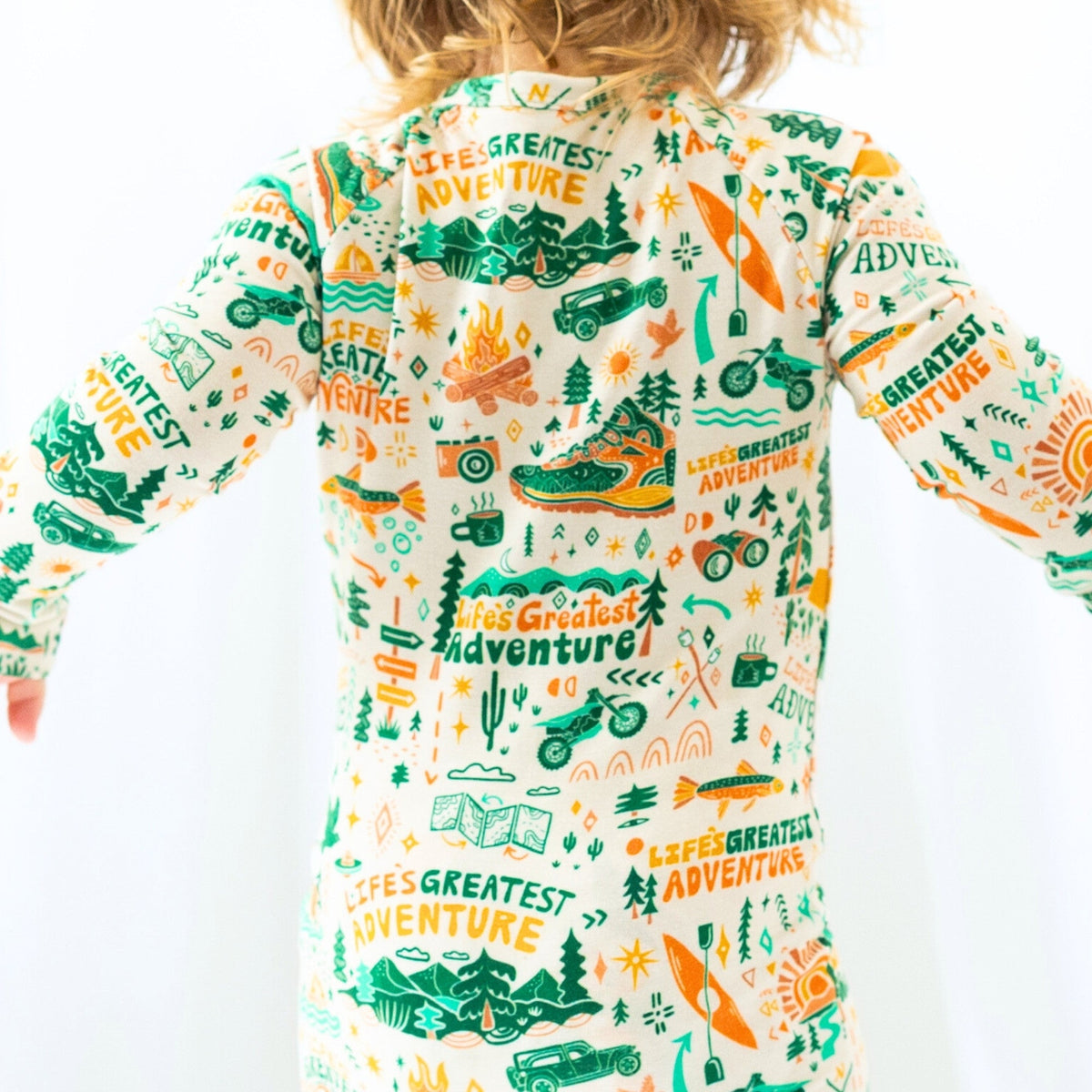 Happy toddler wearing the Second-Skin Toddler Convertible Romper, enjoying comfort and flexibility while playing.