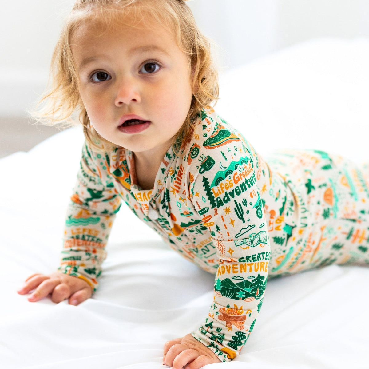 The Second-Skin Toddler Convertible Romper laid out flat, showing its durable fabric and stylish features.