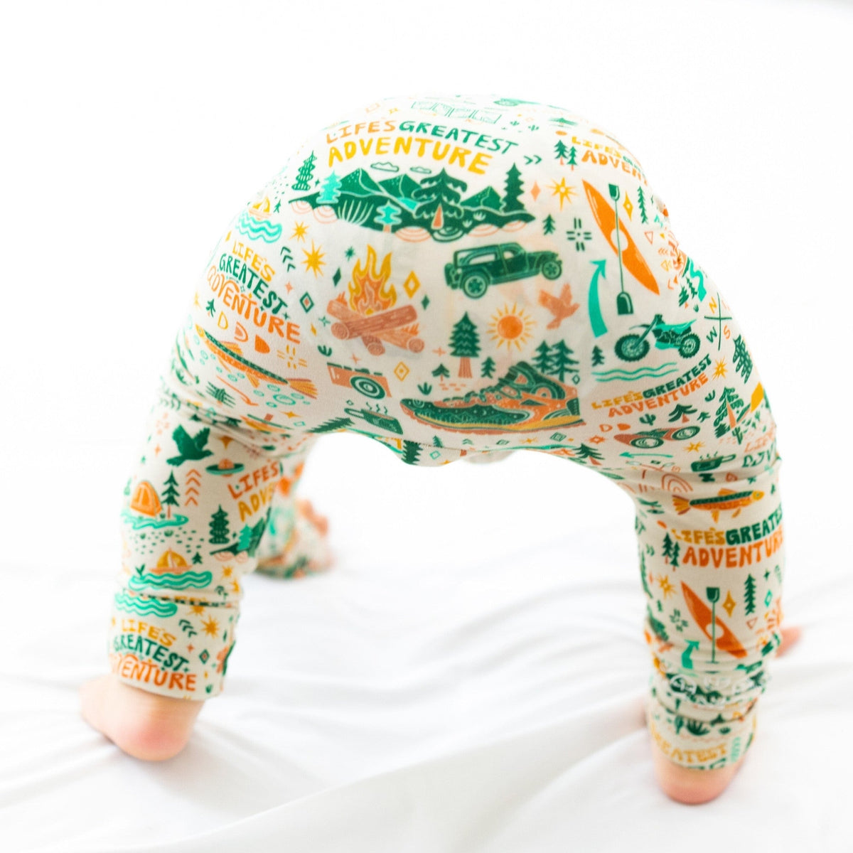 The Second-Skin Toddler Convertible Romper being modeled by a toddler, emphasizing its trendy design and comfort for all-day wear.