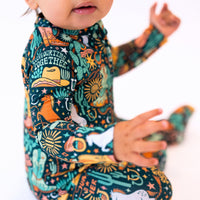 Baby in The Second-Skin Convertible Romper | Wild West print, buttery soft bamboo viscose, zippered.