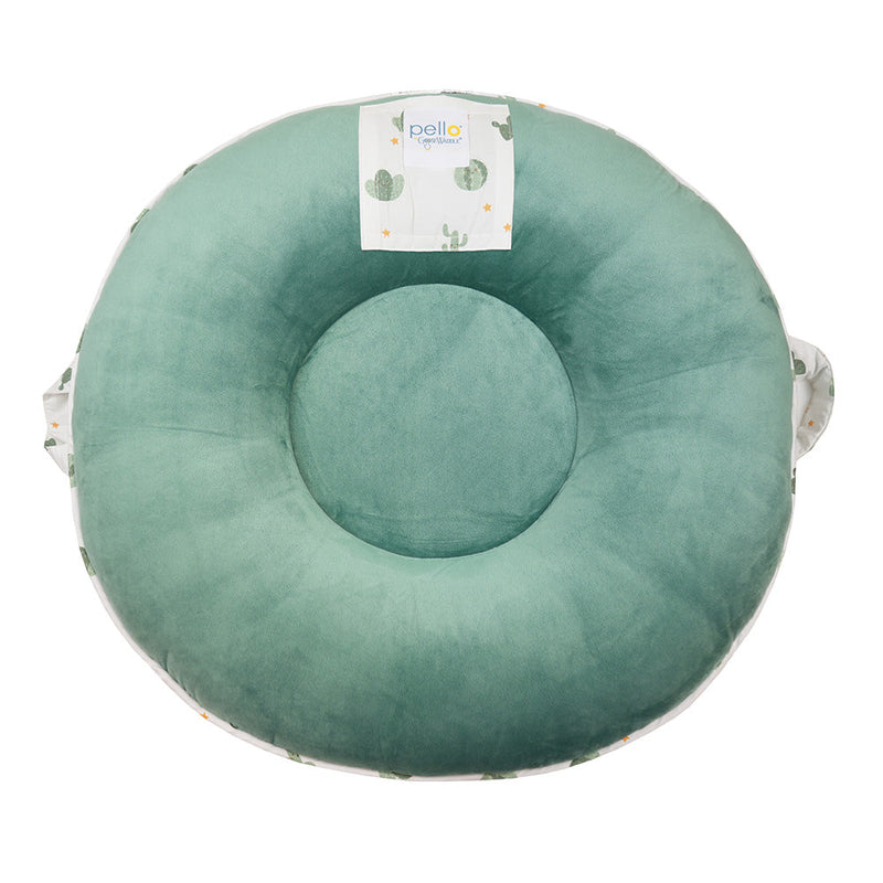 Top view of the Wilder Sage Floor Cushion, showcasing a smooth green texture and a fun cactus pattern. Ideal for children 12 months and older to explore and play safely.