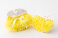 Two yellow ruffle tutu bloomers with elastic waist; one features a bow, full front-and-back ruffles.