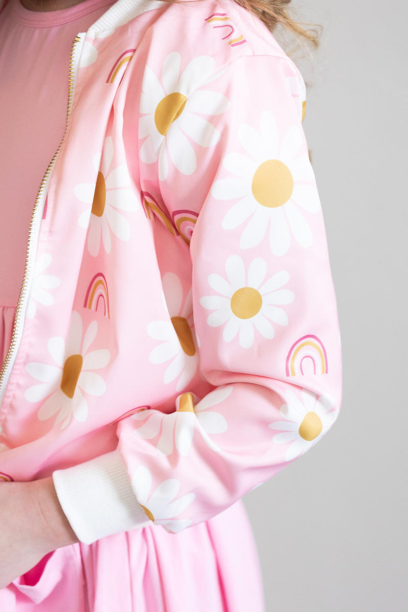 Close-up of the You are My Sunshine Satin Jacket showcasing the lovely floral pattern with white daisies and golden elements, ideal for children.