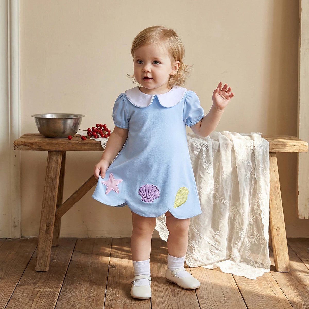 baby girls light blue a-line dress wedding style with puff sleeves and seashell appliques