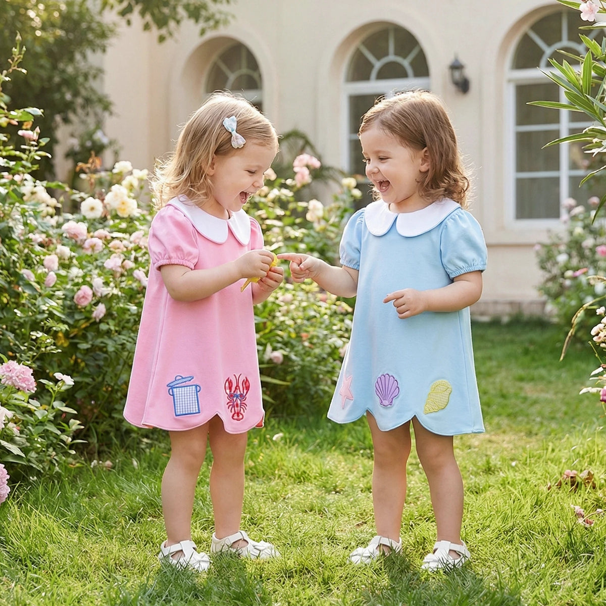 Toddler girls pink and blue a-line dress style with white collars and sea-themed appliques ages 2 to 3