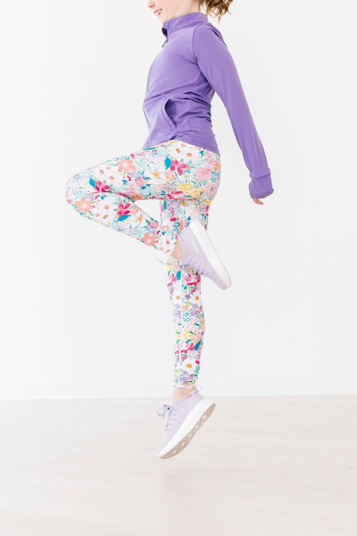 Women's colorful floral active leggings by Mila & Rose with a high-waist fit and vibrant pattern