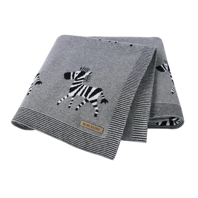 Gray animal baby blankets for babies with black and white zebra design and striped edges