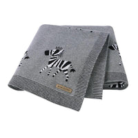 Gray animal baby blankets for babies with black and white zebra design and striped edges