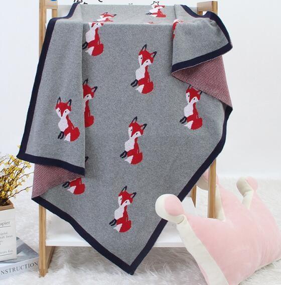 Gray animal knit baby blanket with red fox pattern, toddler size, soft and cozy knit fabric