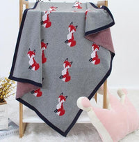 Gray animal knit baby blanket with red fox pattern, toddler size, soft and cozy knit fabric