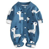 Blue baby romper with white and black animal print giraffes, long sleeve and button closure for infants