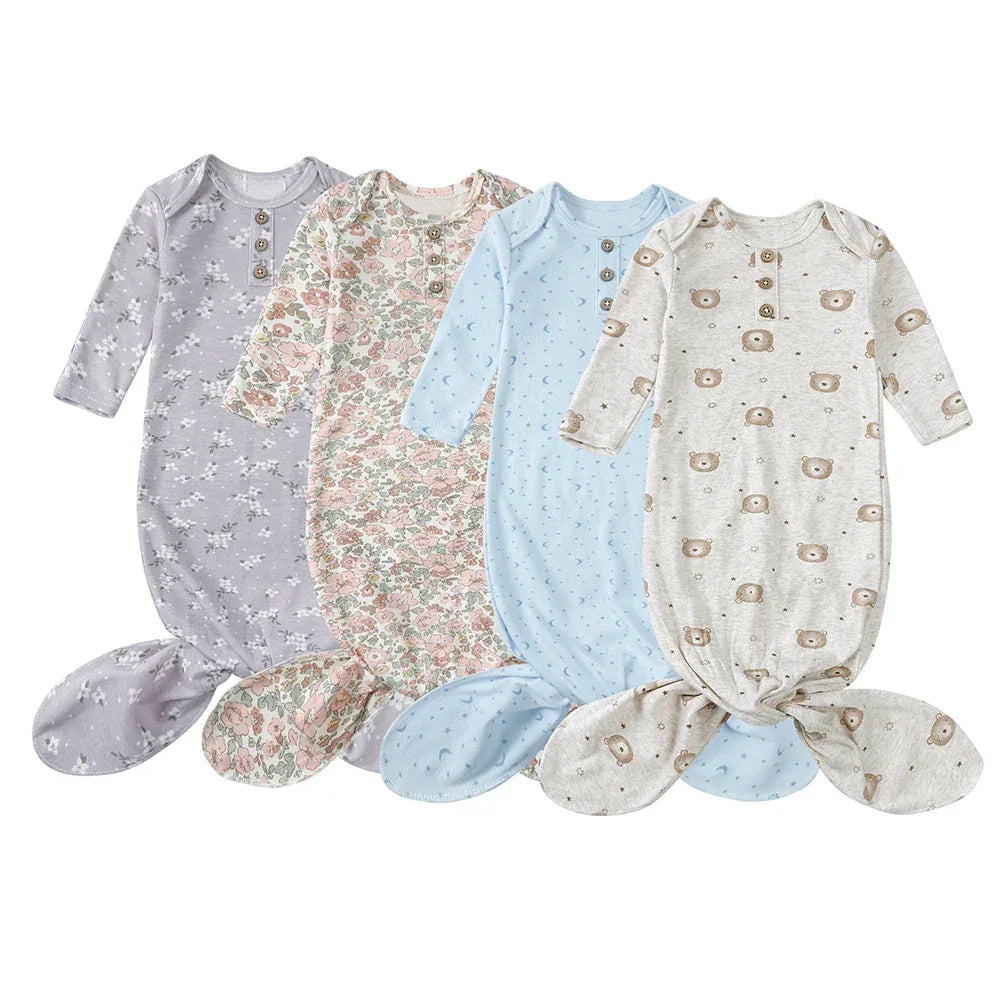 Set of four anti-kick baby sleeping gowns in pastel colors with floral and bear prints for newborns