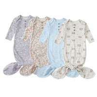Set of four anti-kick baby sleeping gowns in pastel colors with floral and bear prints for newborns