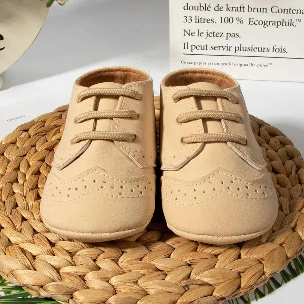 Beige anti-slip baby shoes for boys in size newborn with lace-up design on woven mat