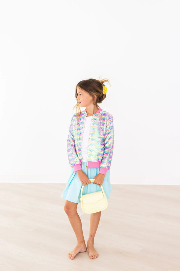 Girls aqua skort for girls in light blue twirl style worn by child with colorful jacket