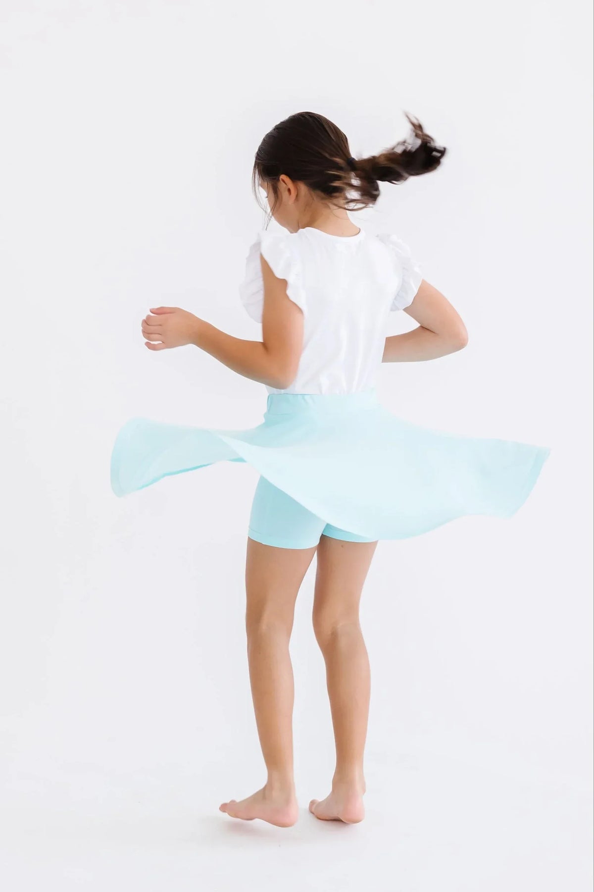 Girls aqua skort for girls by Mila & Rose with twirl design, mid-length and built-in shorts