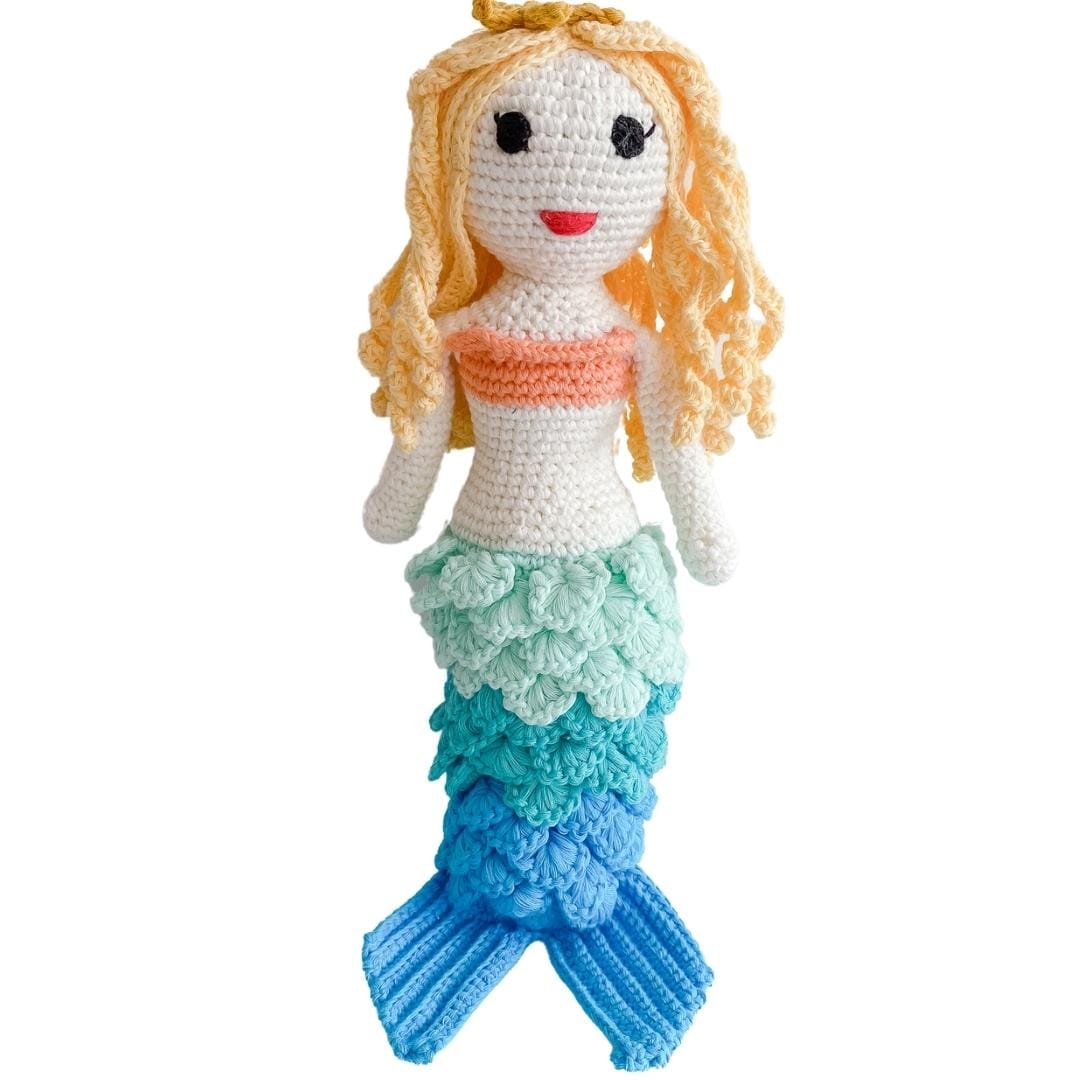 Crochet blonde mermaid doll with blue-green tail and tiny crown. Soft organic cotton amigurumi toy for underwater dreamers.